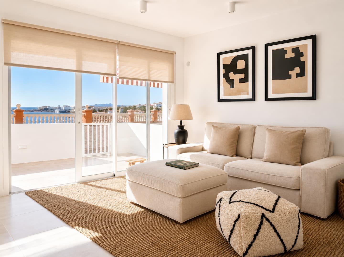 Living room with a sofa and sea views through the sliding doors