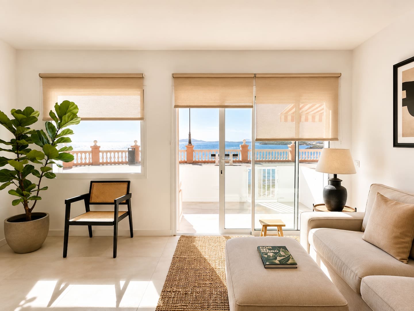 Living room with an armchair and doors onto the terrace