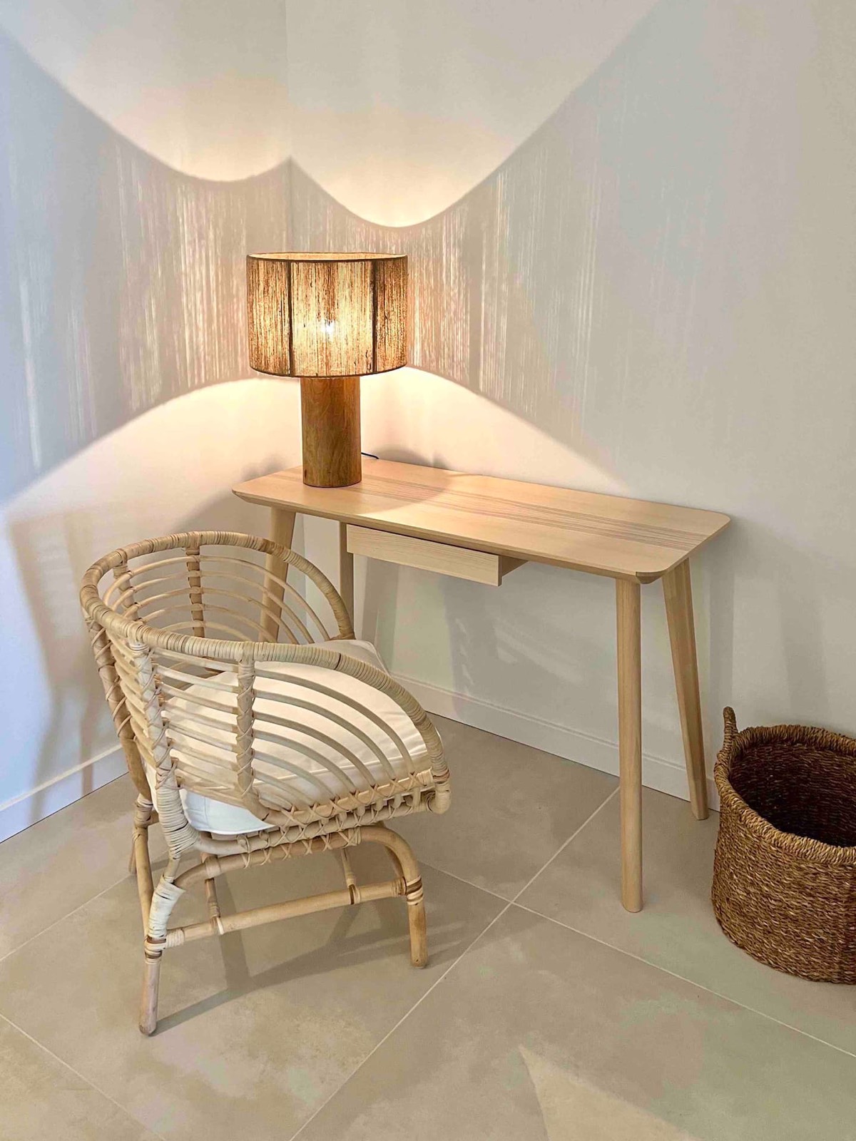 Desk and rattan chair in the main bedroom
